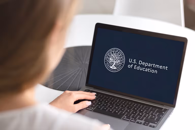 Dept of Ed logo on laptop
