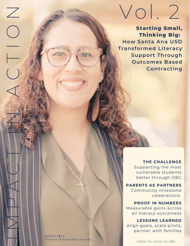 Woman in business attire and glasses smiling