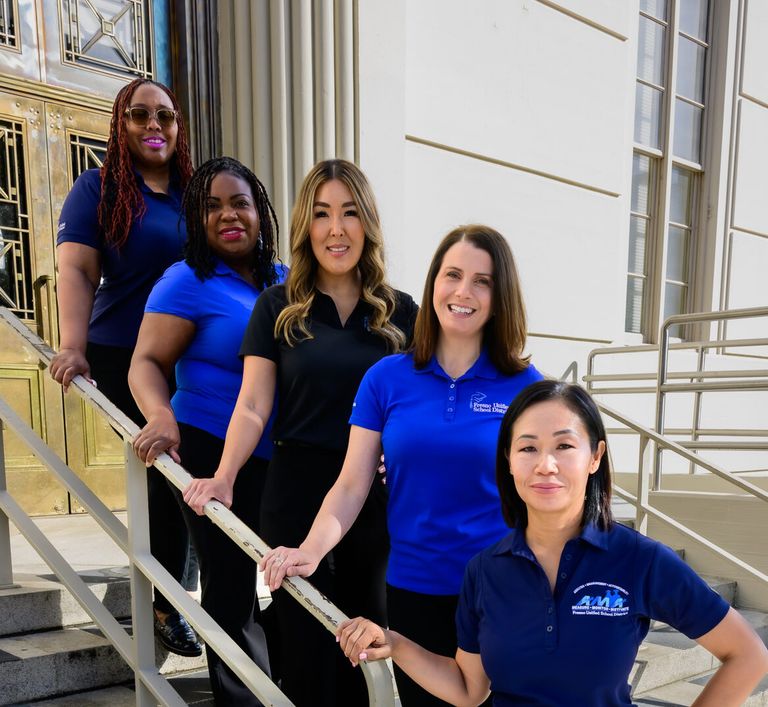 five women on stairs